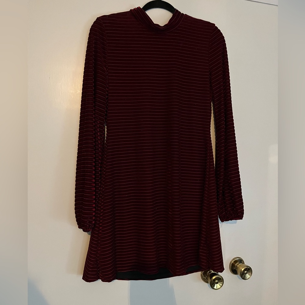 Lulu’s red velvet dress. Has slight turtle neck and bubble sleeves.